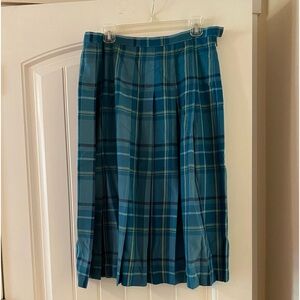 Plaid , pleated skirt.